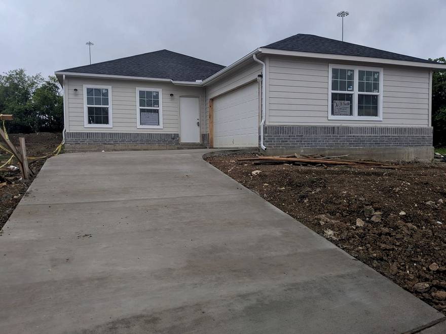 Full driveway poured out to the street