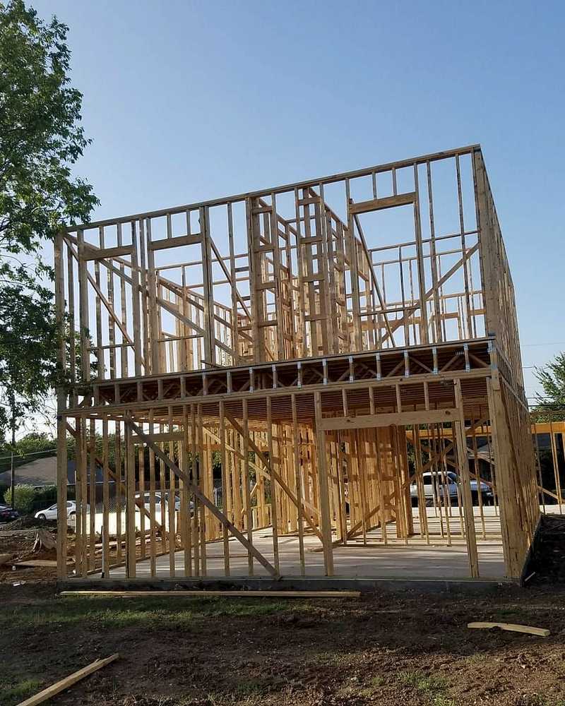 Two story shell framed over a new slab